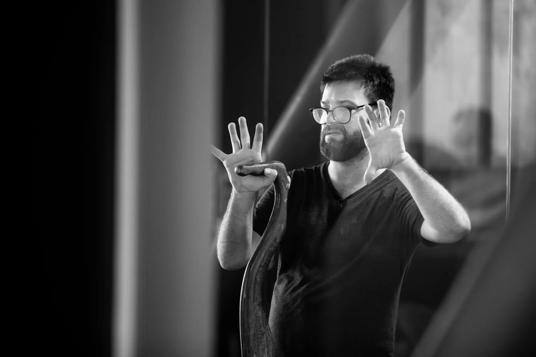 Tedy Necula directing on set, black and white